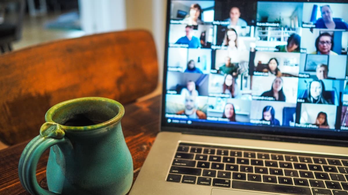 Remote worker recording an async video update, from the async communication guide for video-first teams