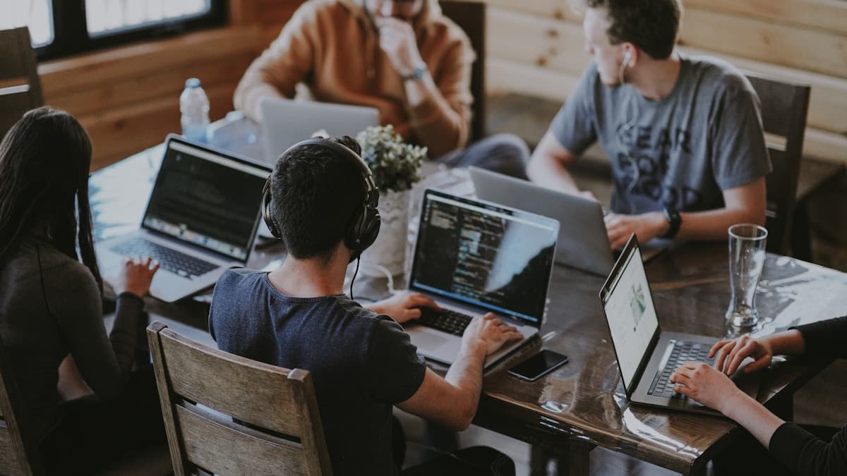A remote team member learning how to give feedback with video on a laptop