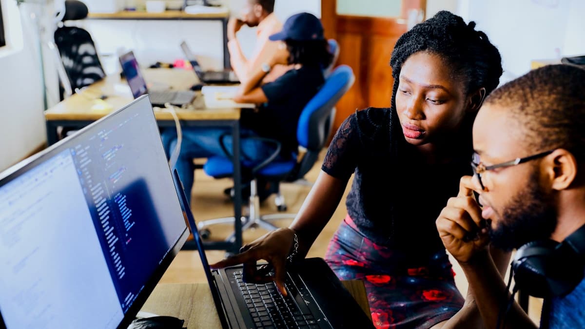 Two monitors side by side comparing video messaging tool options